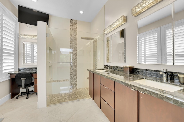 bathroom featuring walk in shower, double vanity, baseboards, tile patterned floors, and recessed lighting