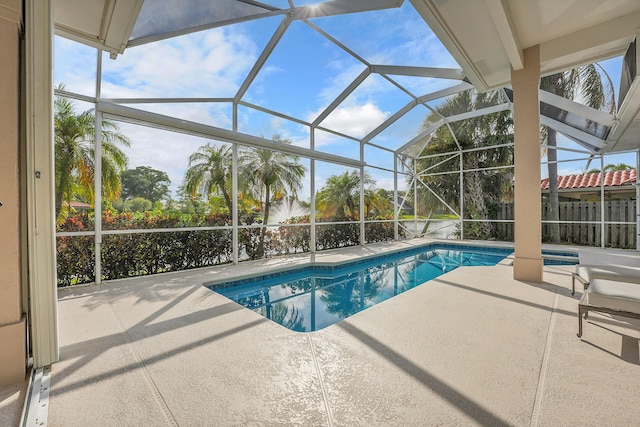 swimming pool with a patio and a lanai