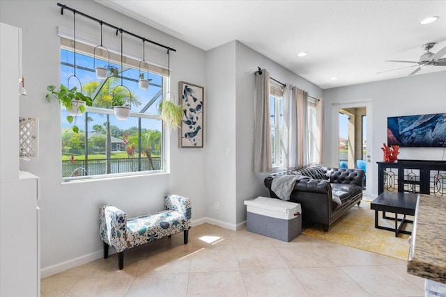living area with ceiling fan, baseboards, recessed lighting, and tile patterned floors