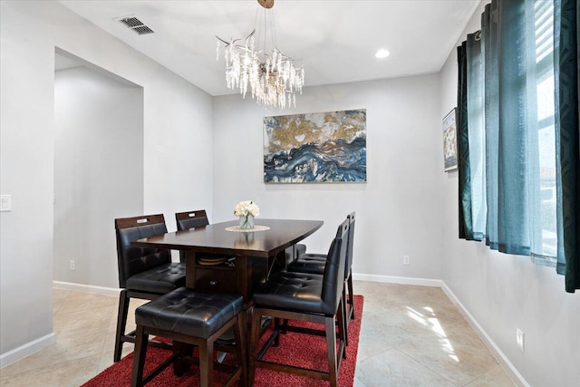 dining room with a chandelier, baseboards, light tile patterned floors, and recessed lighting