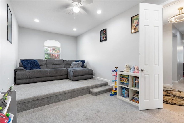 carpeted living room featuring a ceiling fan, recessed lighting, and baseboards