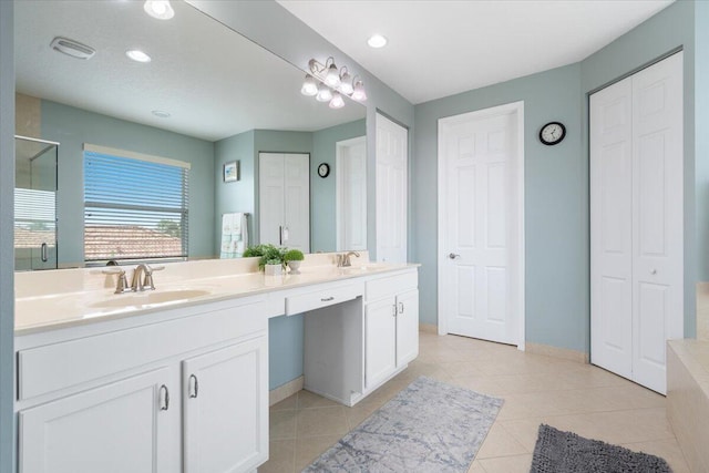 11400 SW Reston Ct, Port Saint Lucie, FL 34987 - bathroom with a closet, double vanity, tile patterned floors, an enclosed shower, and recessed lighting