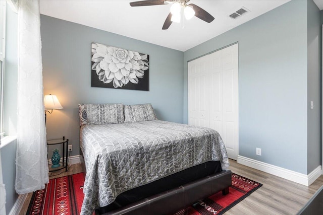 11400 SW Reston Ct, Port Saint Lucie, FL 34987 - bedroom featuring wood finished floors, a closet, and ceiling fan