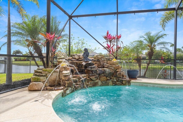 view of swimming pool featuring fence