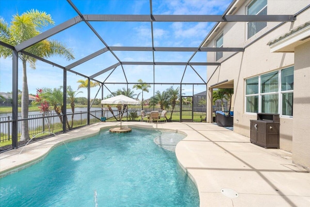 view of pool with a patio area, a water view, fence, and a lanai