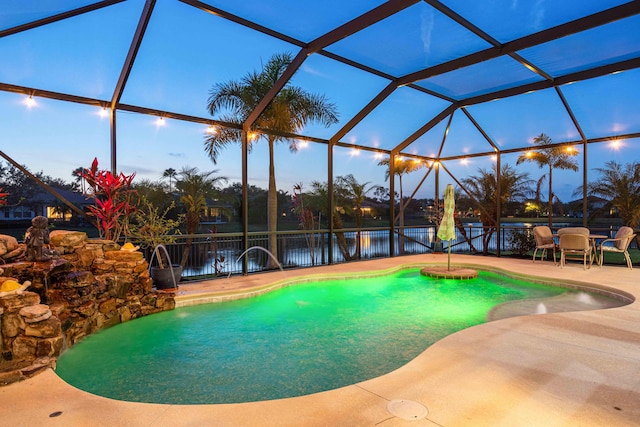 view of swimming pool featuring a patio, glass enclosure, and a fenced backyard