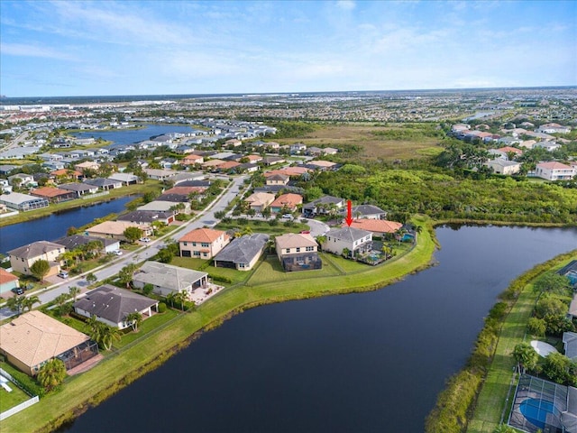 view of property location featuring nearby suburban area and a large body of water