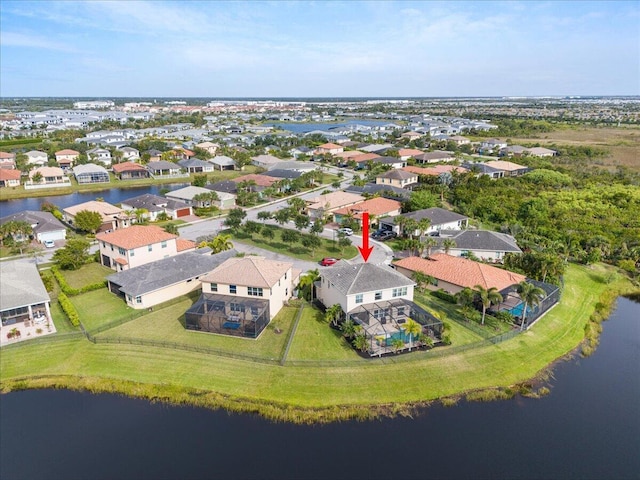 aerial view of residential area with a large body of water