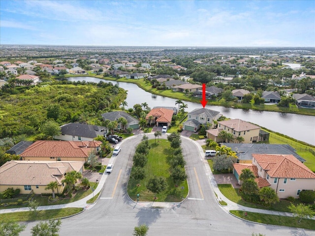 aerial view of residential area with a large body of water