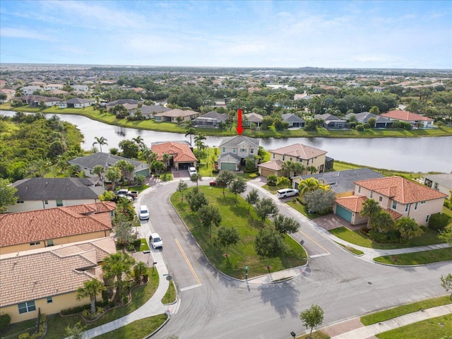 aerial perspective of suburban area featuring a large body of water