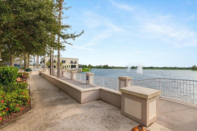 surrounding community with a water view