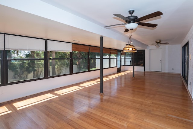 3984 SE Fairway E, Stuart, FL 34997 - unfurnished room featuring ceiling fan and wood finished floors