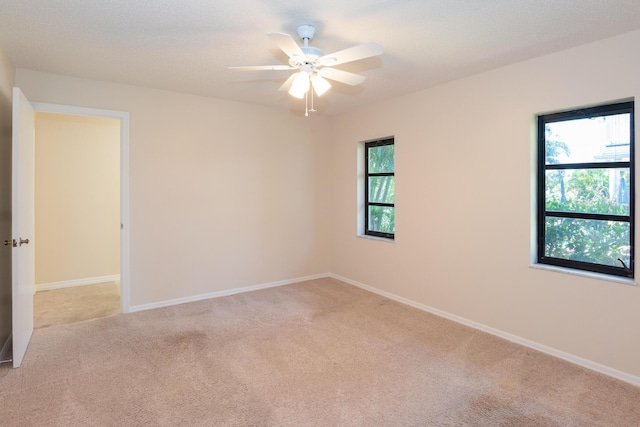 3984 SE Fairway E, Stuart, FL 34997 - carpeted spare room featuring baseboards and a healthy amount of sunlight
