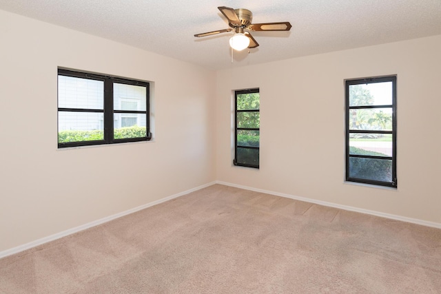 3984 SE Fairway E, Stuart, FL 34997 - unfurnished room with baseboards, ceiling fan, and light carpet