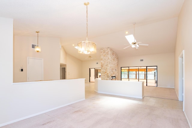 3984 SE Fairway E, Stuart, FL 34997 - spare room featuring high vaulted ceiling, visible vents, ceiling fan with notable chandelier, and light colored carpet