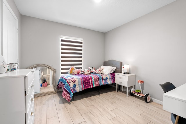 885 SW Squirrel Ave, Port Saint Lucie, FL 34953 - bedroom with light wood-type flooring