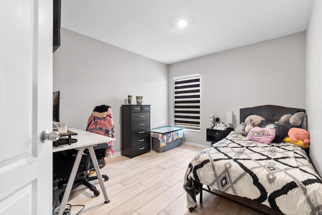 885 SW Squirrel Ave, Port Saint Lucie, FL 34953 - bedroom featuring wood tiled floors and a desk