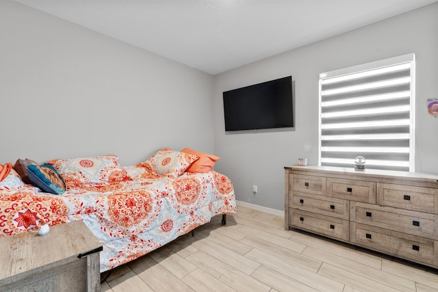 885 SW Squirrel Ave, Port Saint Lucie, FL 34953 - bedroom featuring wood finish floors and baseboards