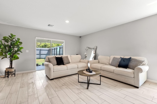 885 SW Squirrel Ave, Port Saint Lucie, FL 34953 - living room featuring light wood finished floors, baseboards, and recessed lighting