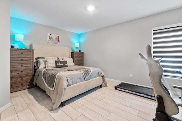 885 SW Squirrel Ave, Port Saint Lucie, FL 34953 - bedroom featuring wood finish floors and baseboards