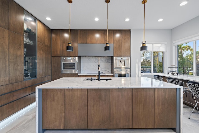 kitchen with recessed lighting, light stone countertops, marble finish floor, and modern cabinets