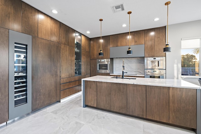 kitchen with recessed lighting, marble finish floor, visible vents, modern cabinets, and light stone countertops