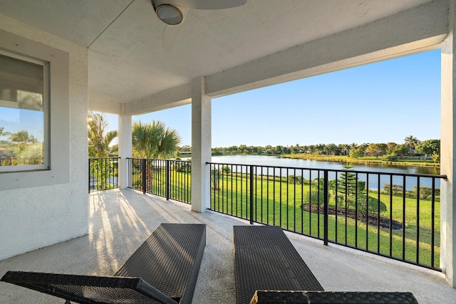 exterior space with a lawn and a water view