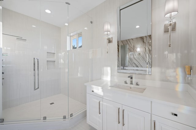 full bathroom with vanity, recessed lighting, and a stall shower