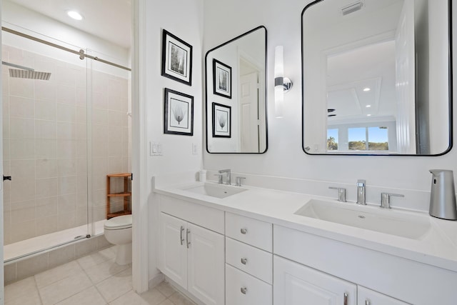 full bath featuring a shower stall, toilet, a sink, and visible vents