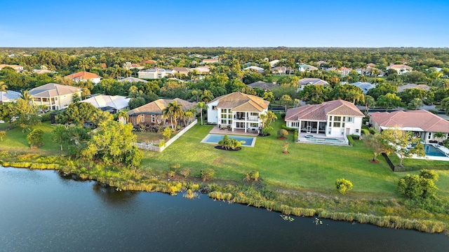 bird's eye view featuring a residential view and a water view