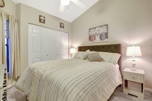 2406 Landings Blvd, Greenacres, FL 33413 - bedroom featuring a closet, light wood-style floors, baseboards, ceiling fan, and high vaulted ceiling