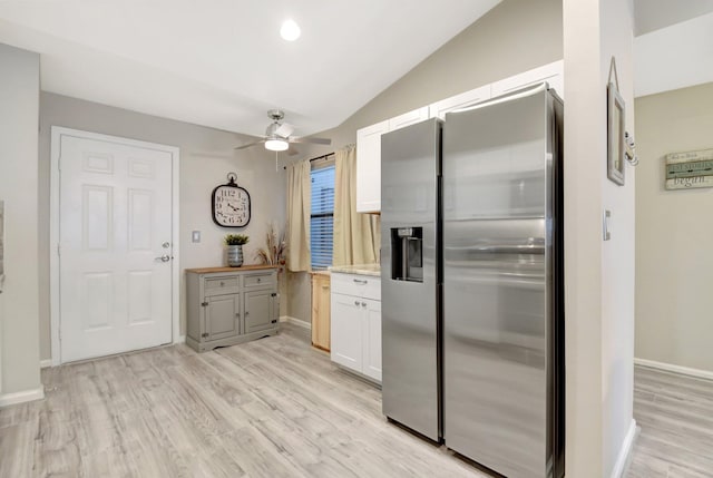 2406 Landings Blvd, Greenacres, FL 33413 - kitchen featuring stainless steel fridge with ice dispenser, ceiling fan, light wood finished floors, lofted ceiling, and baseboards