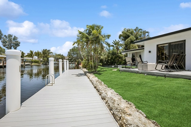 2409 NE 18th Ave, Wilton Manors, FL 33305 - dock area featuring a lawn and a water view