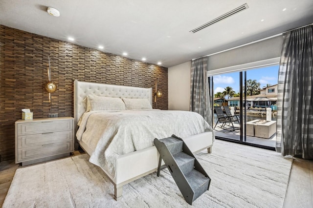 2409 NE 18th Ave, Wilton Manors, FL 33305 - bedroom featuring access to outside, recessed lighting, and wood finished floors