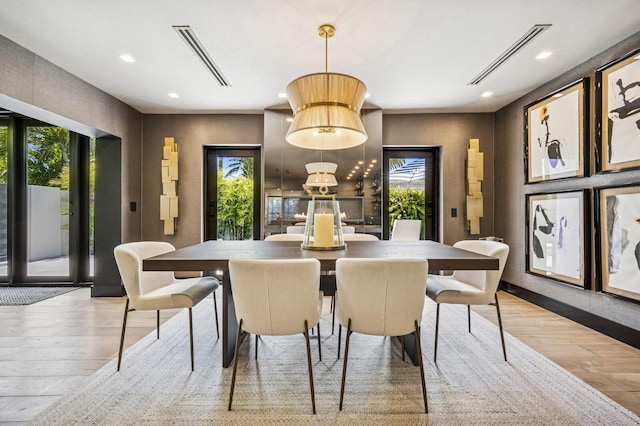 2409 NE 18th Ave, Wilton Manors, FL 33305 - dining space with hardwood / wood-style flooring, plenty of natural light, and recessed lighting
