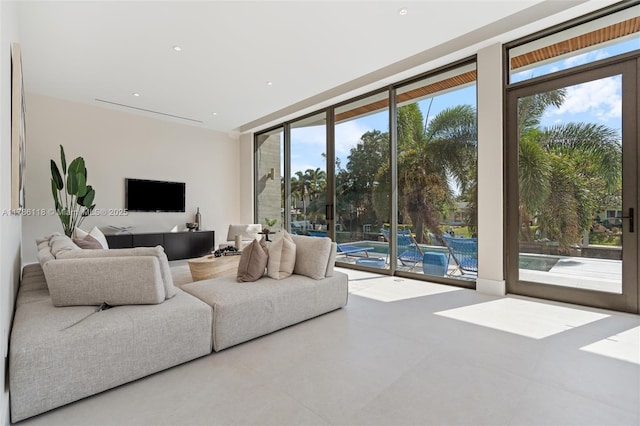 living room featuring a wall of windows