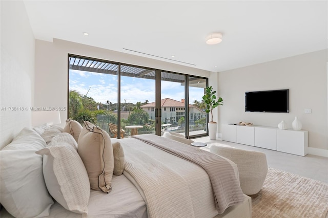 bedroom featuring baseboards, access to outside, recessed lighting, and multiple windows