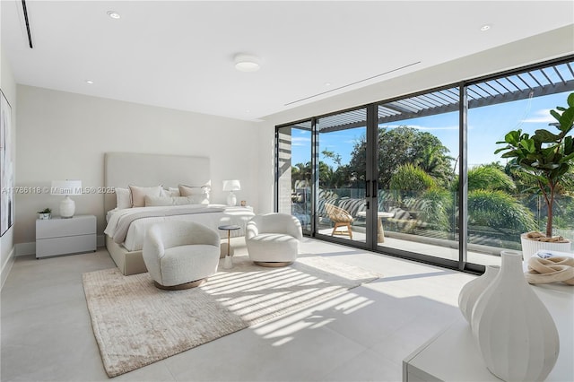 bedroom featuring access to outside and finished concrete floors