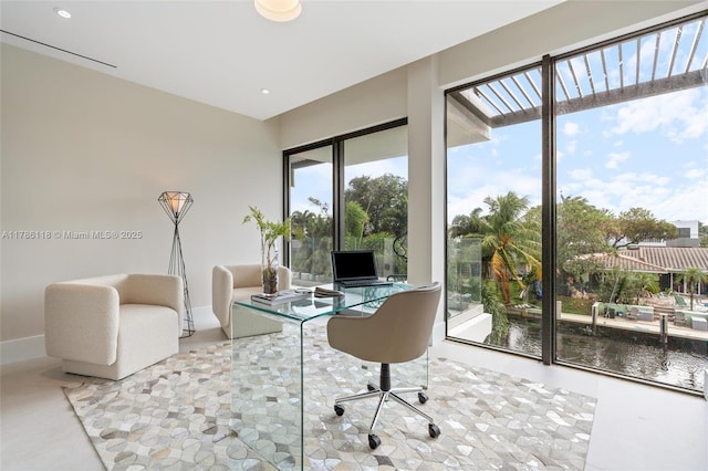 office area with plenty of natural light and baseboards