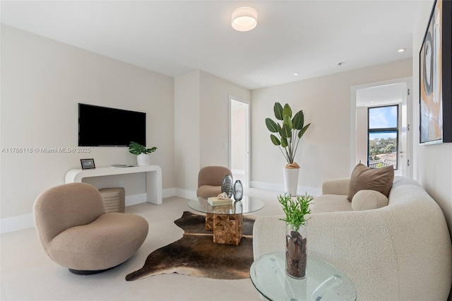 living area with baseboards and recessed lighting