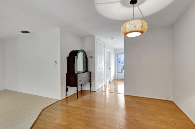 spare room with visible vents and light wood-style floors