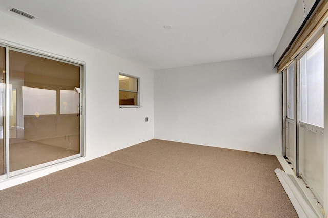 unfurnished sunroom featuring visible vents