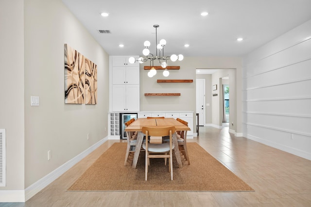 dining space with a chandelier, baseboards, visible vents, and recessed lighting