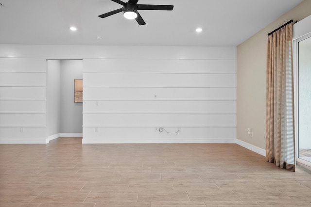 unfurnished room with light wood-style flooring, baseboards, a ceiling fan, and recessed lighting