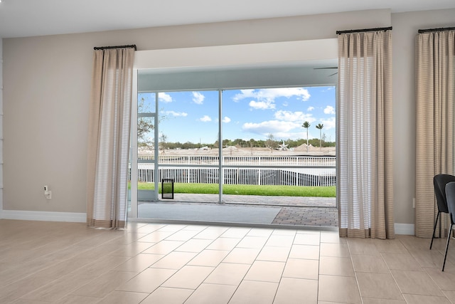 spare room with baseboards