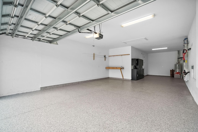 garage with water heater, refrigerator, and a garage door opener