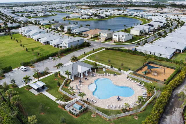 drone / aerial view featuring a water view and a residential view