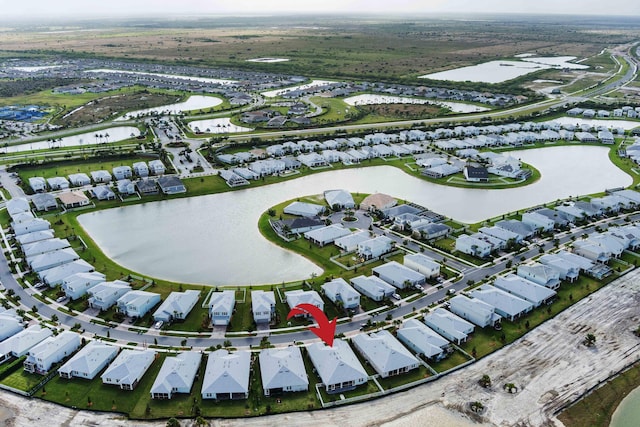 aerial view with a water view and a residential view