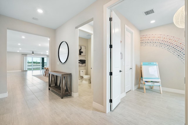 hallway with visible vents and recessed lighting