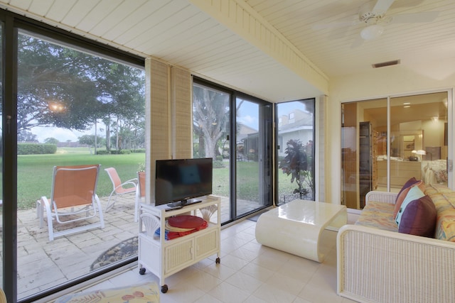 6907 Fountains Cir, Lake Worth, FL 33467 - sunroom with a ceiling fan, tile patterned floors, and expansive windows